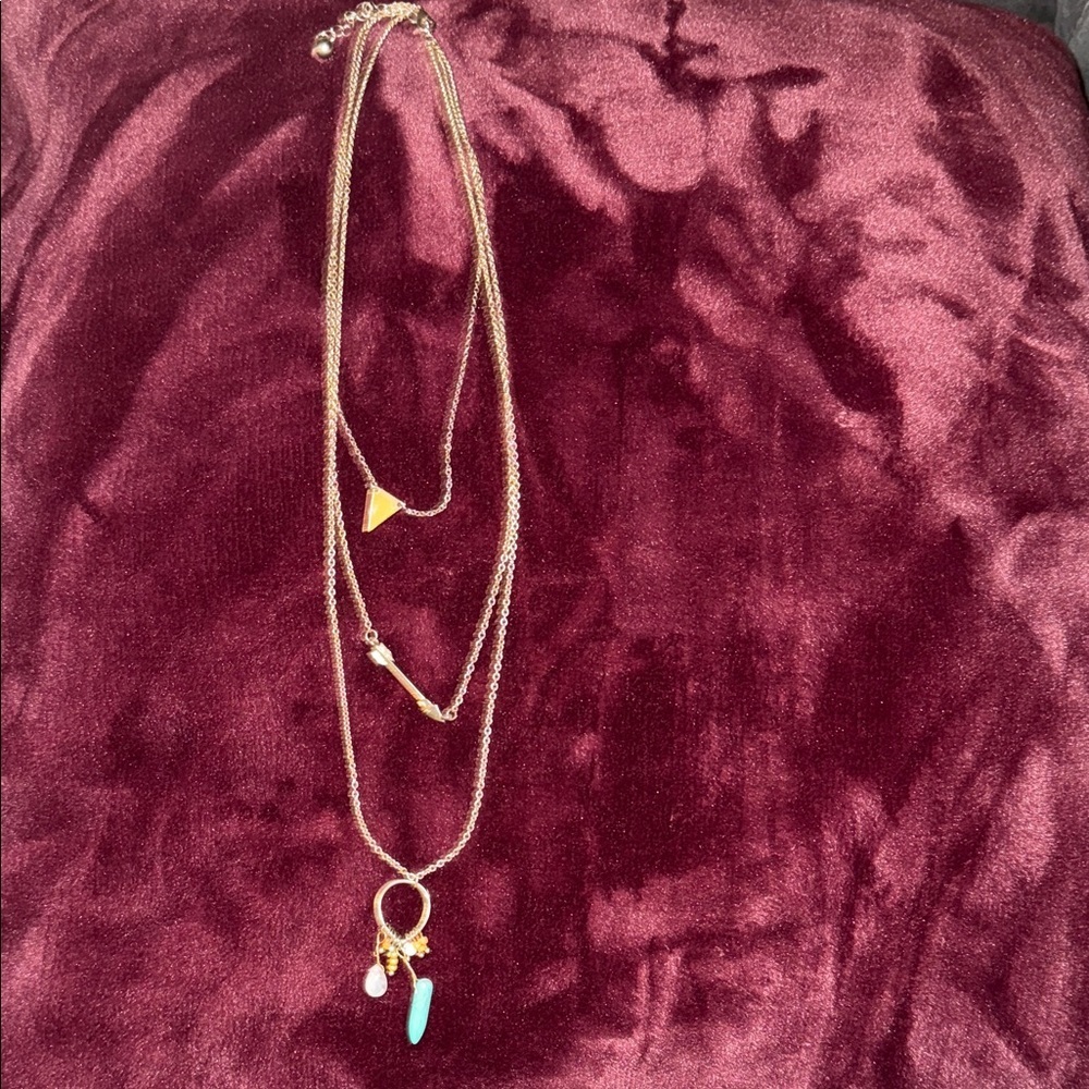 Long three tier strand necklace